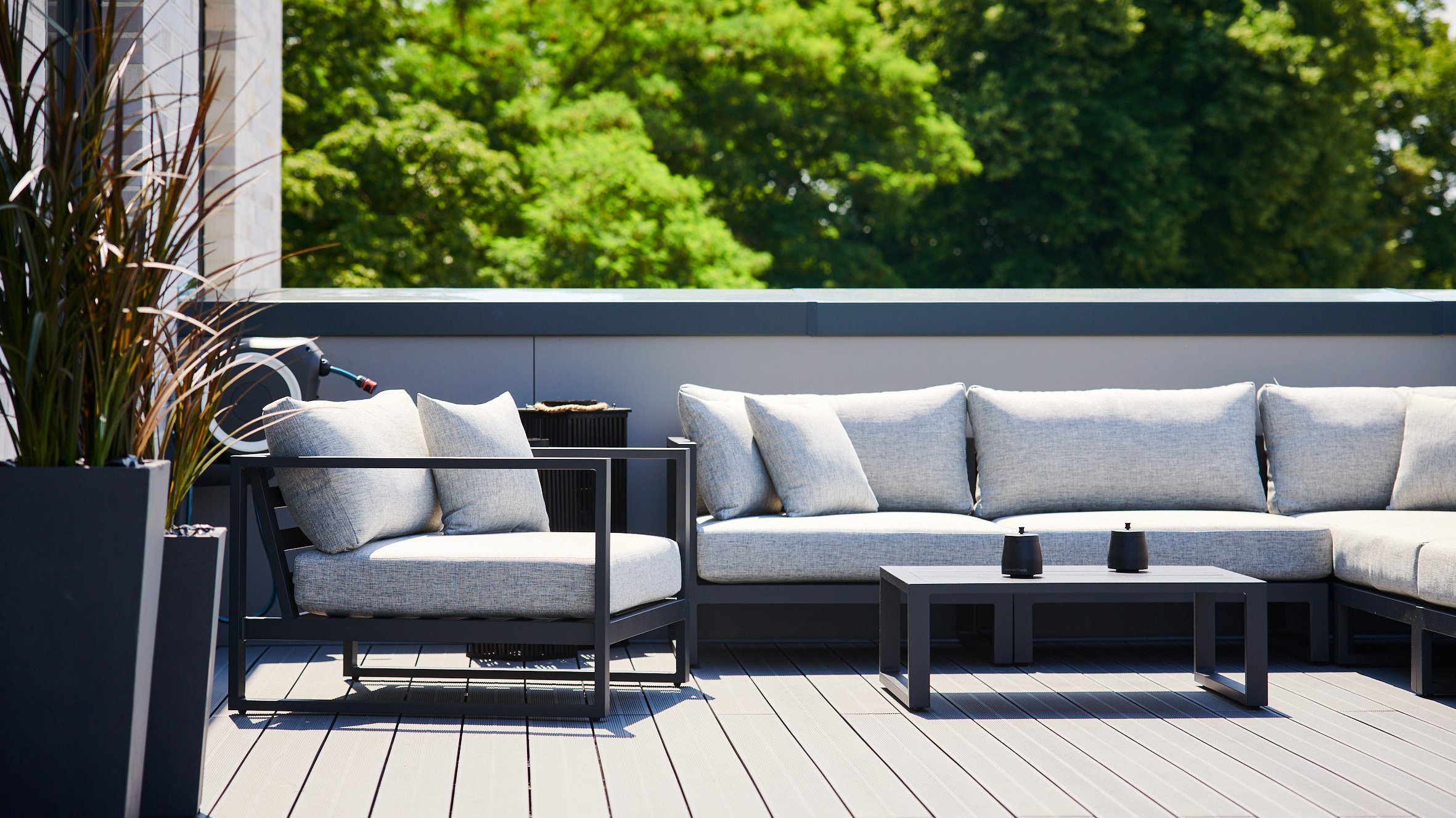 Terrace with modern sofas and green views